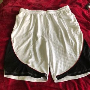 White and black basketball shorts.